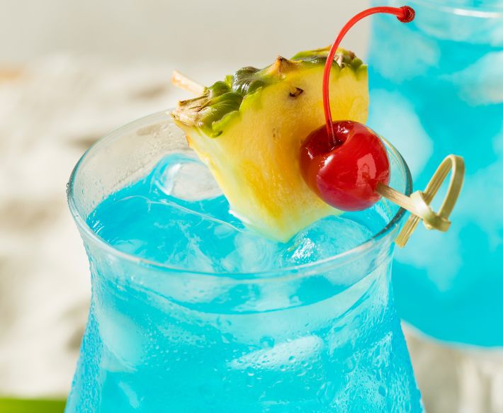 Blue alcoholic drink with pineapple and cherry garnish at Ocean City Fontainebleau Resort in Ocean City, MD