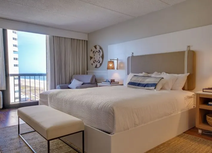 Large bed with balcony and ocean view